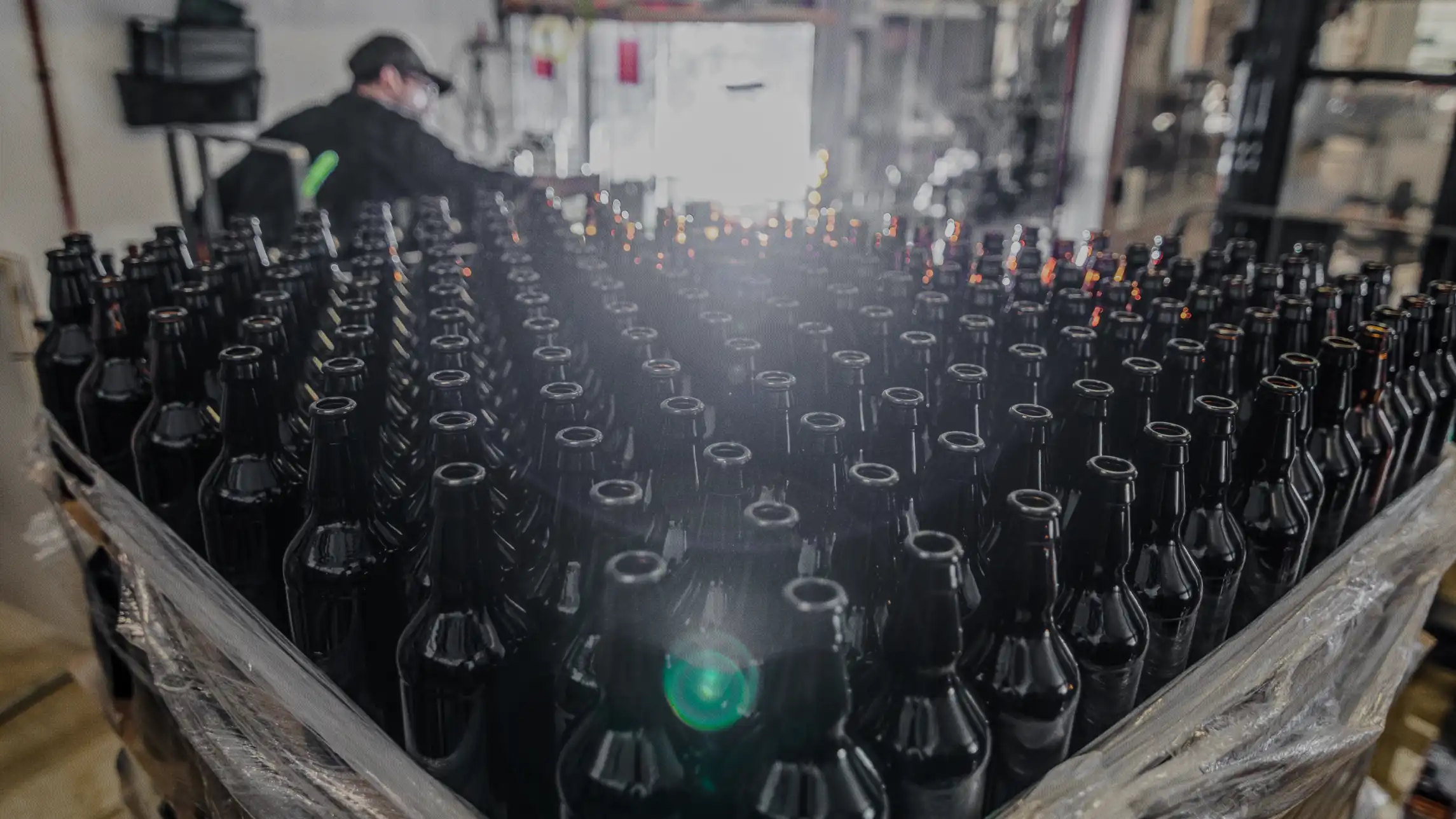 Empty glass bottles in production