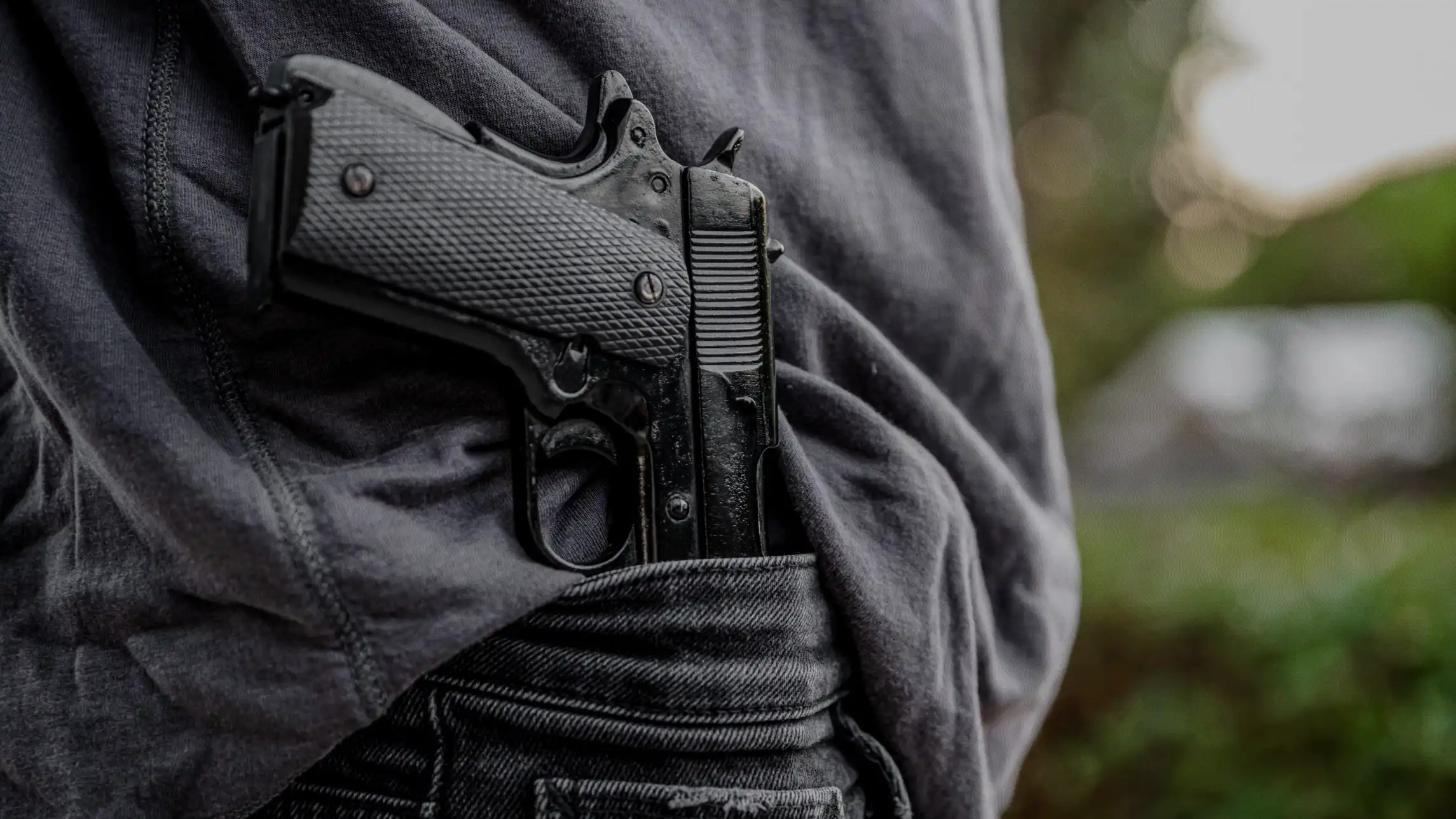 Handgun concealed in person's waistband
