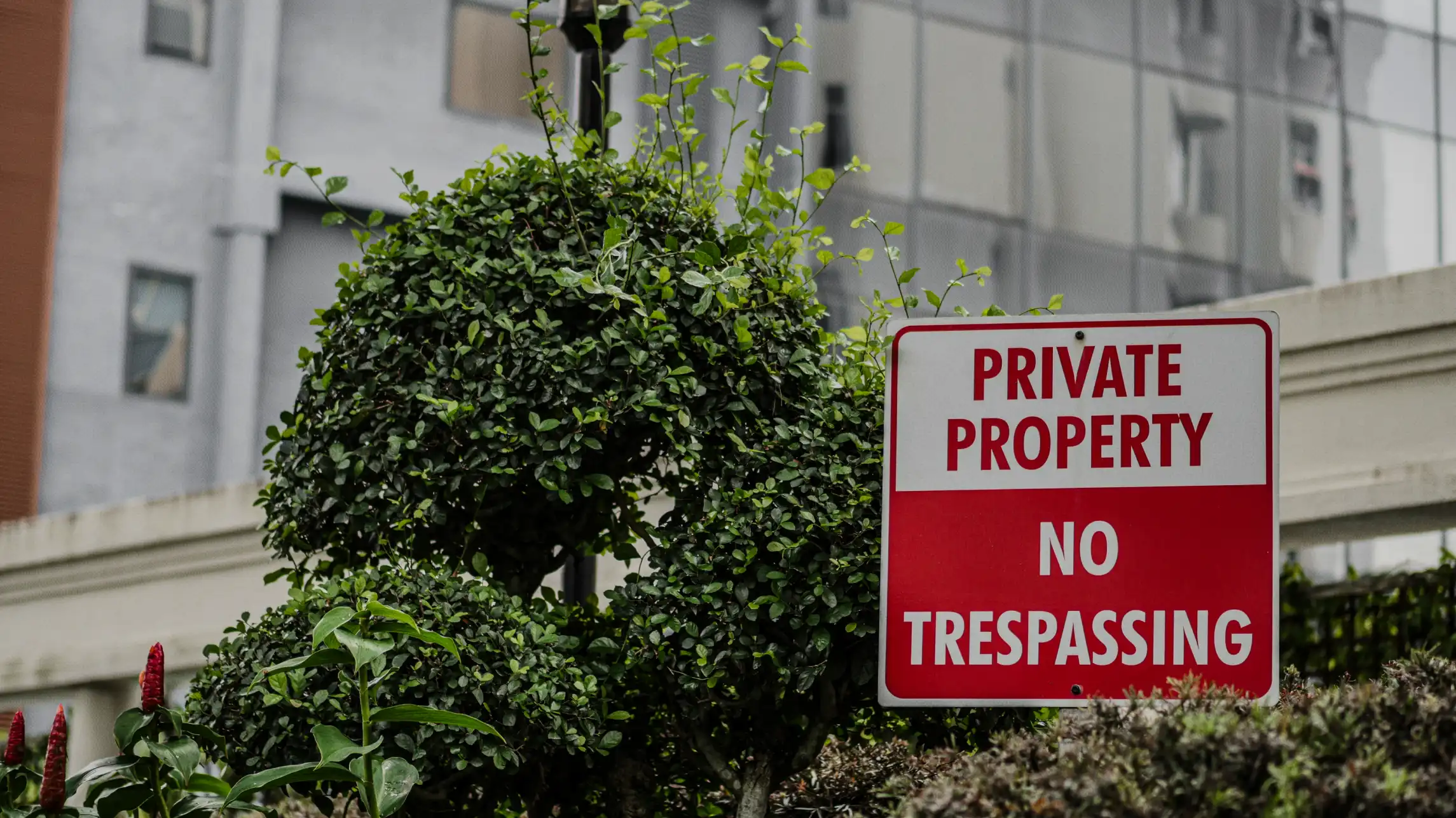 Private property: no trespassing sign in front of building