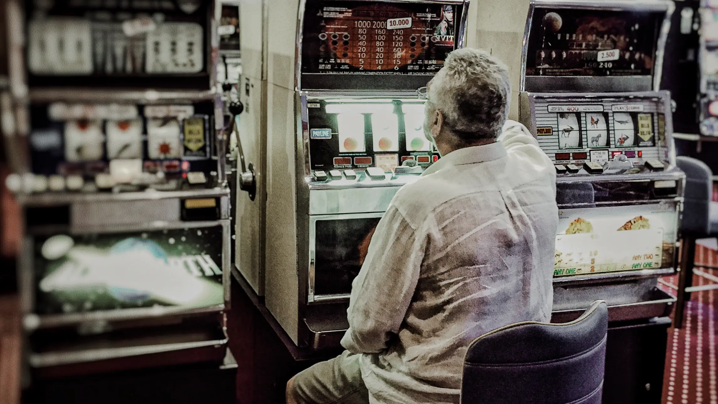 Man sitting at casino slot machine