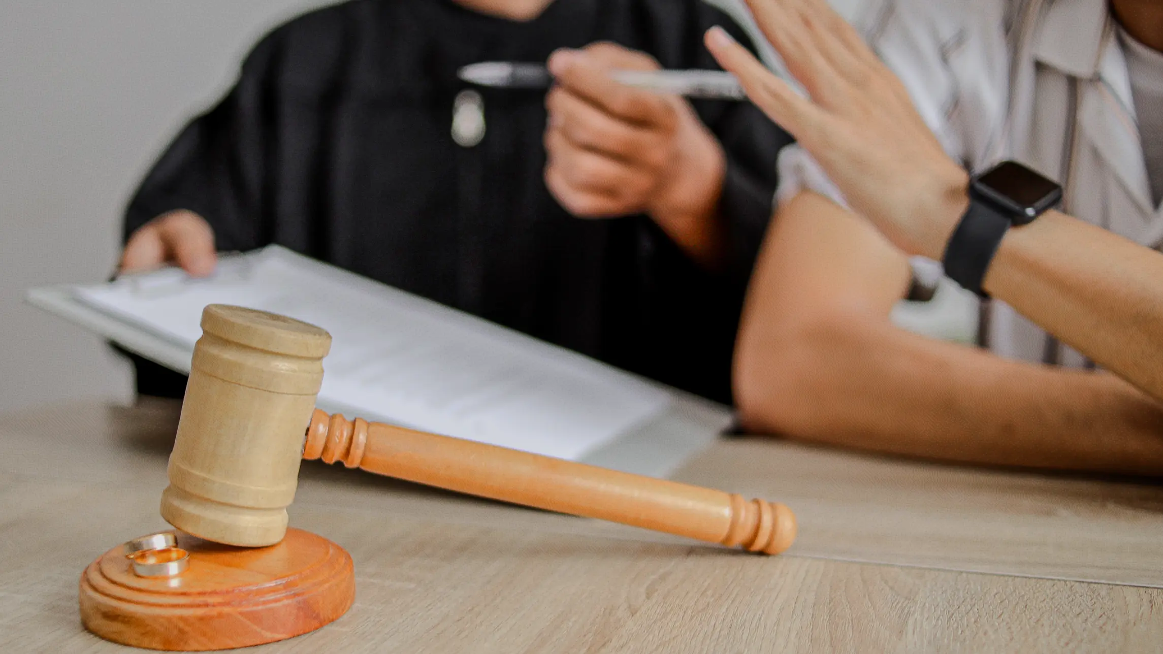 Man interrupting court signature during divorce hearing