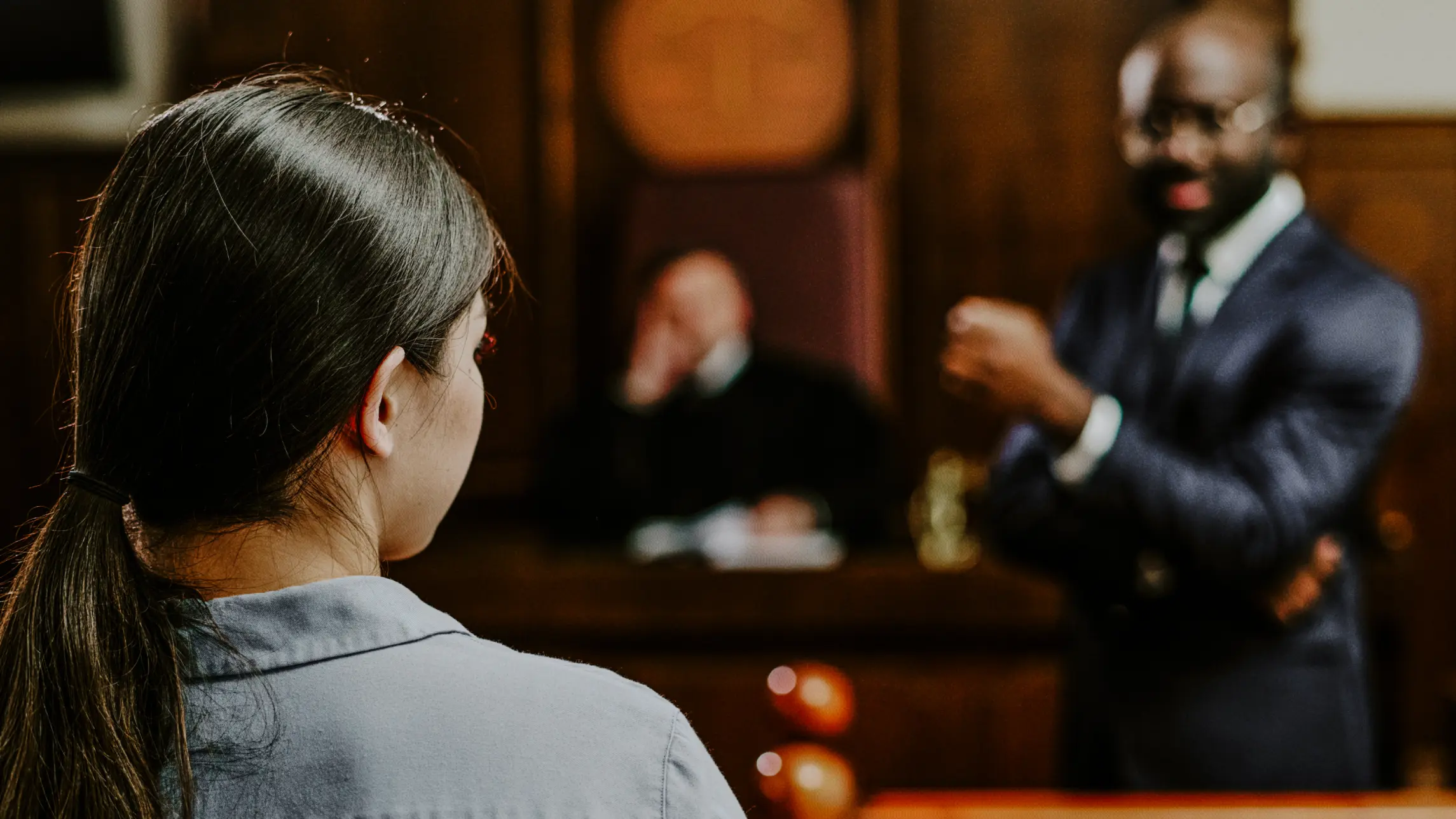 Woman standing on trial before judge and jury