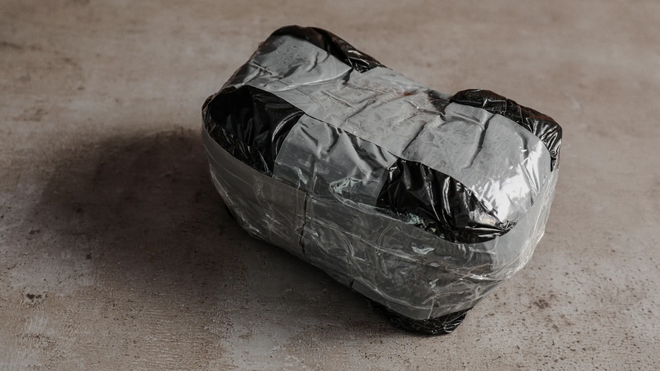 Brick of illegal drugs wrapped in duct tape
