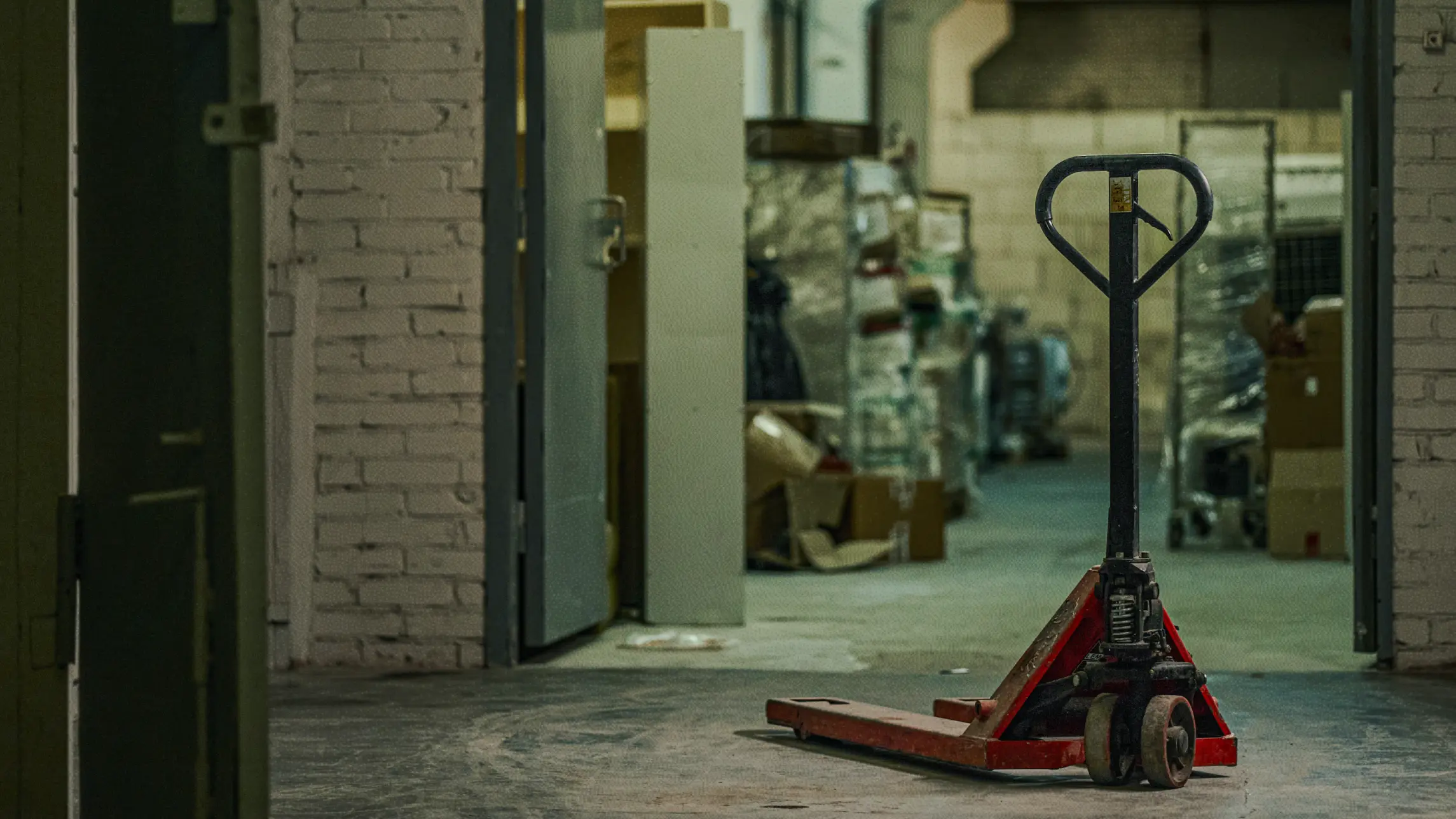 Lone dolly in dark abandoned warehouse