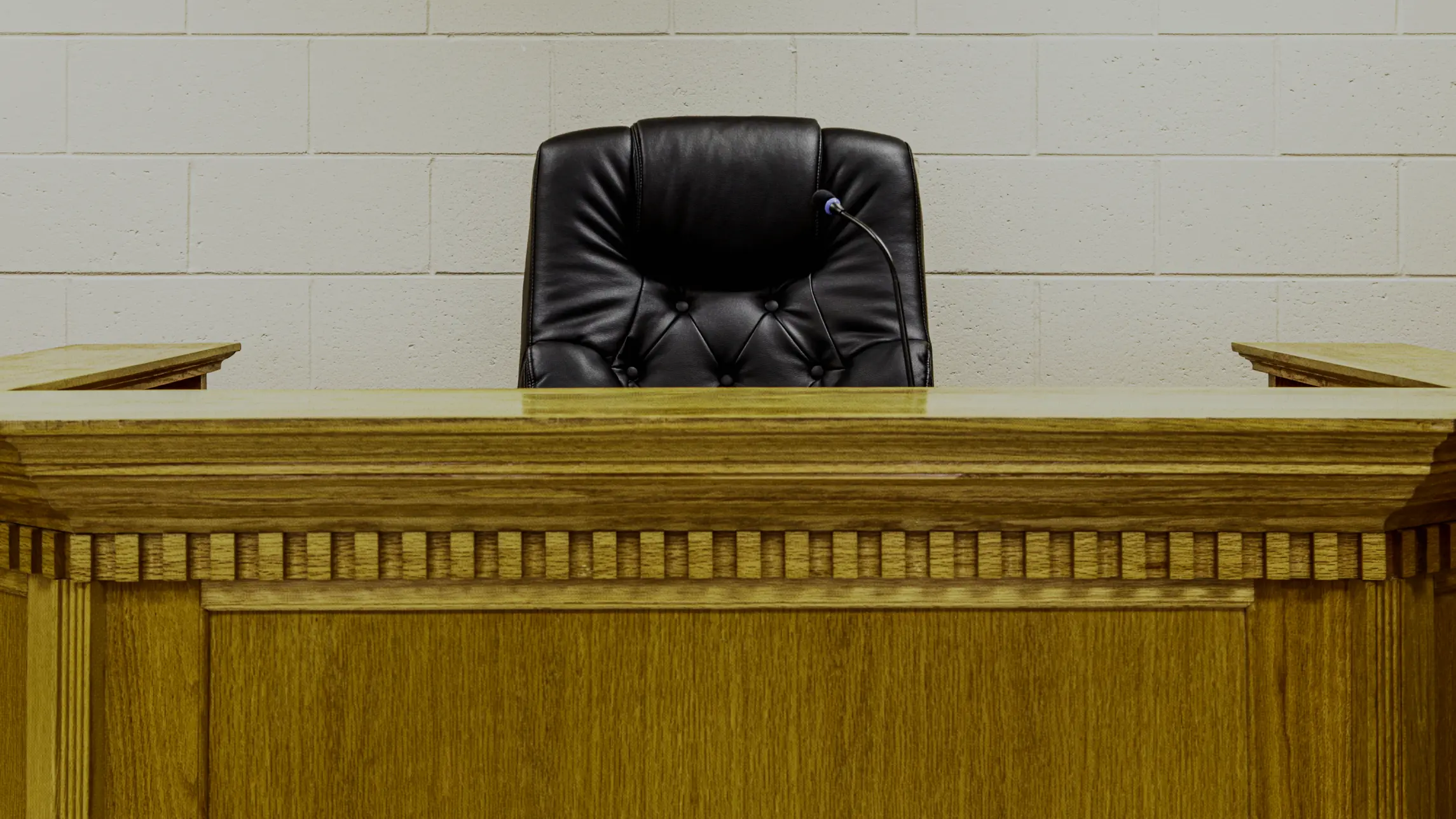 Empty judge's chair in courtroom