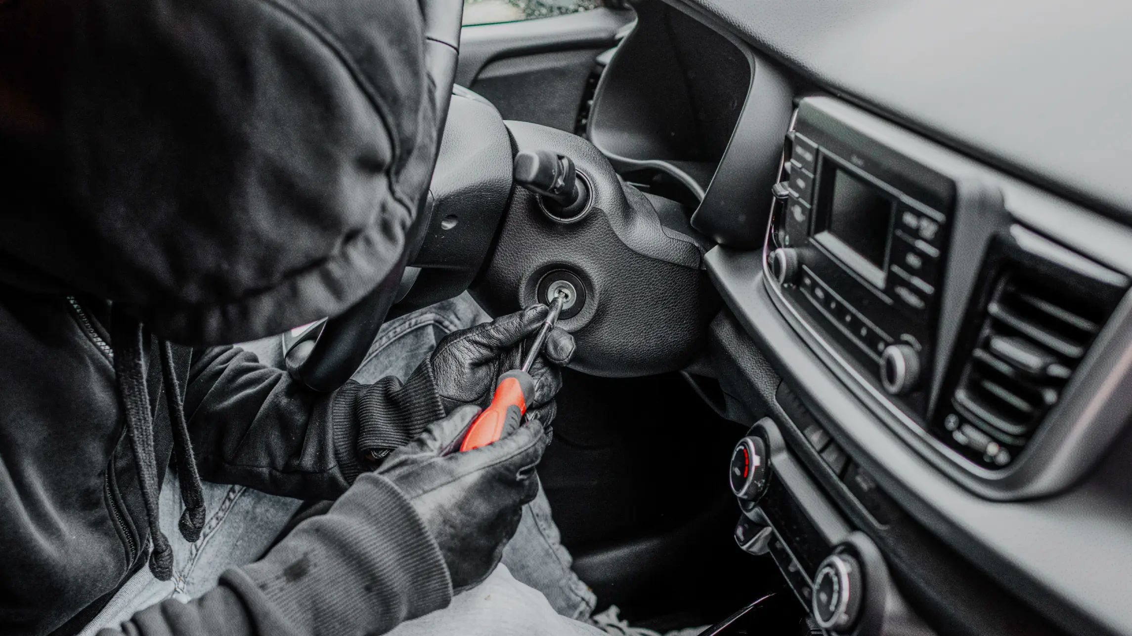 Person with gloves on carjacking a vehicle dressed in all black