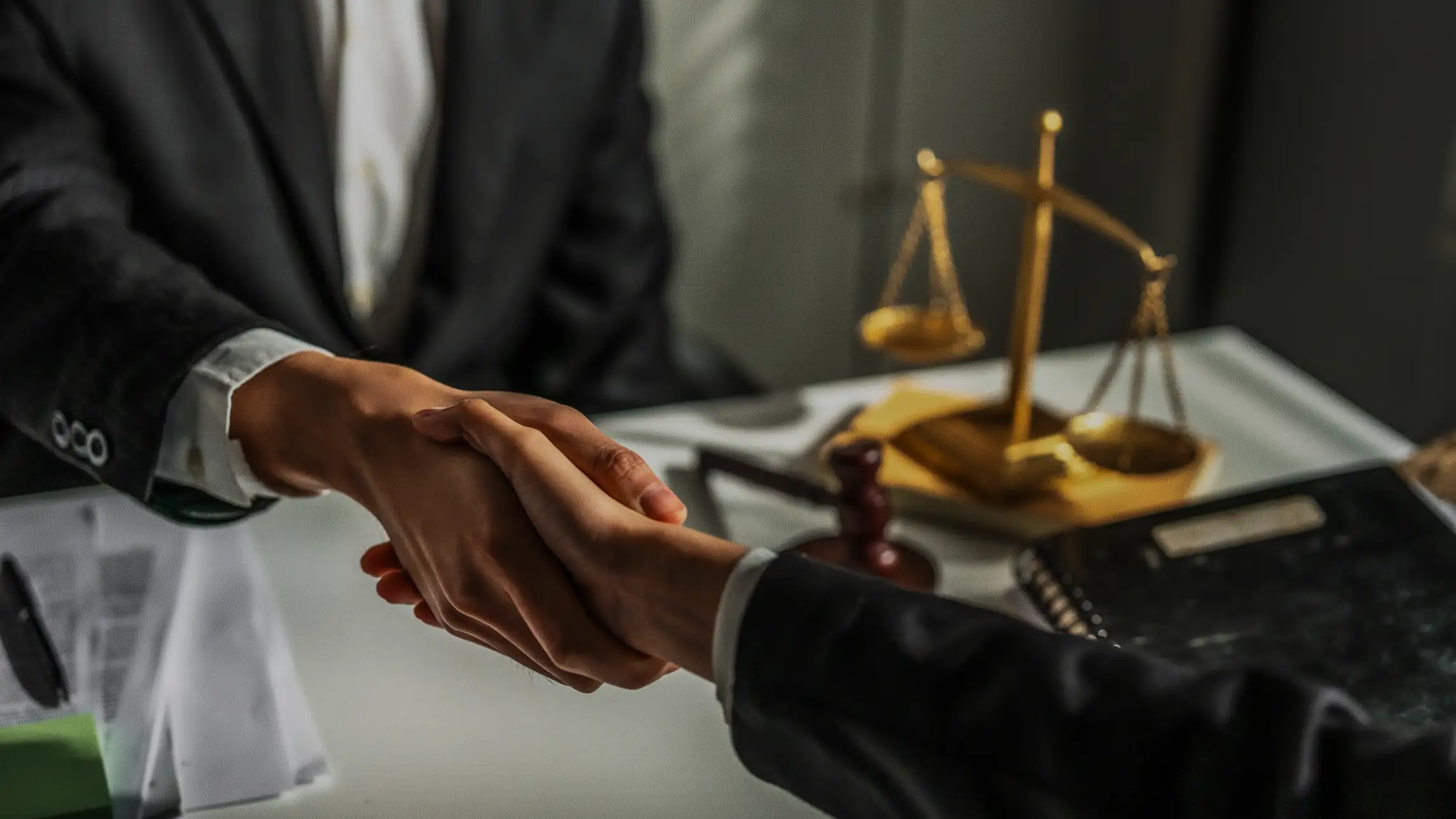Shaking hands in legal office