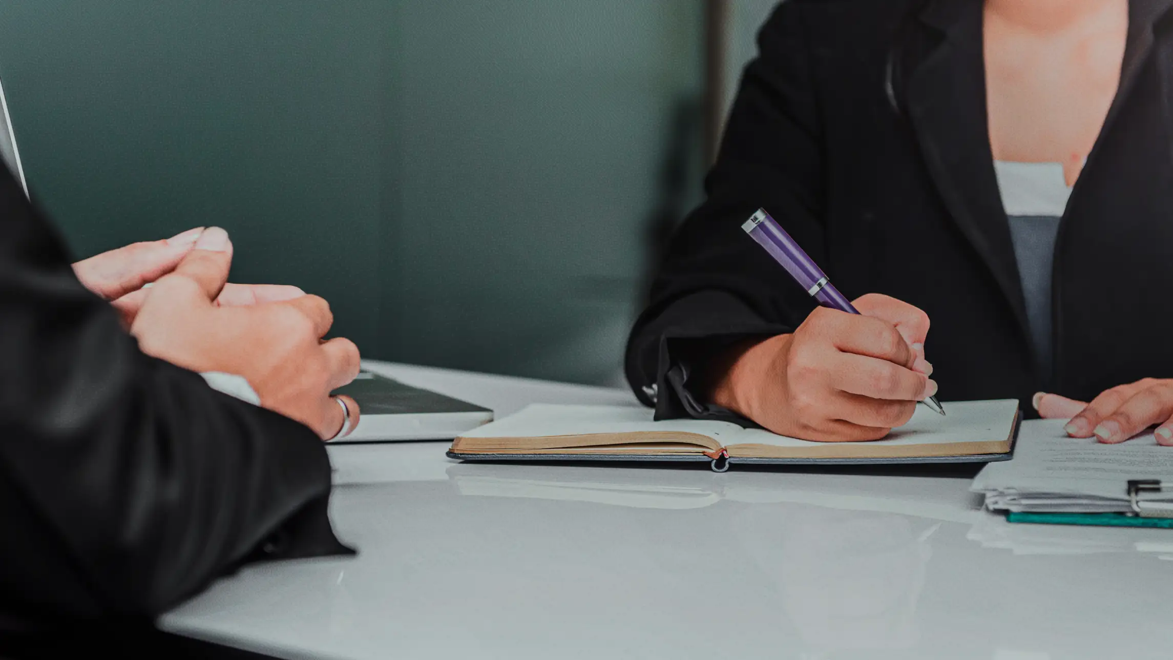 Woman taking notes in office