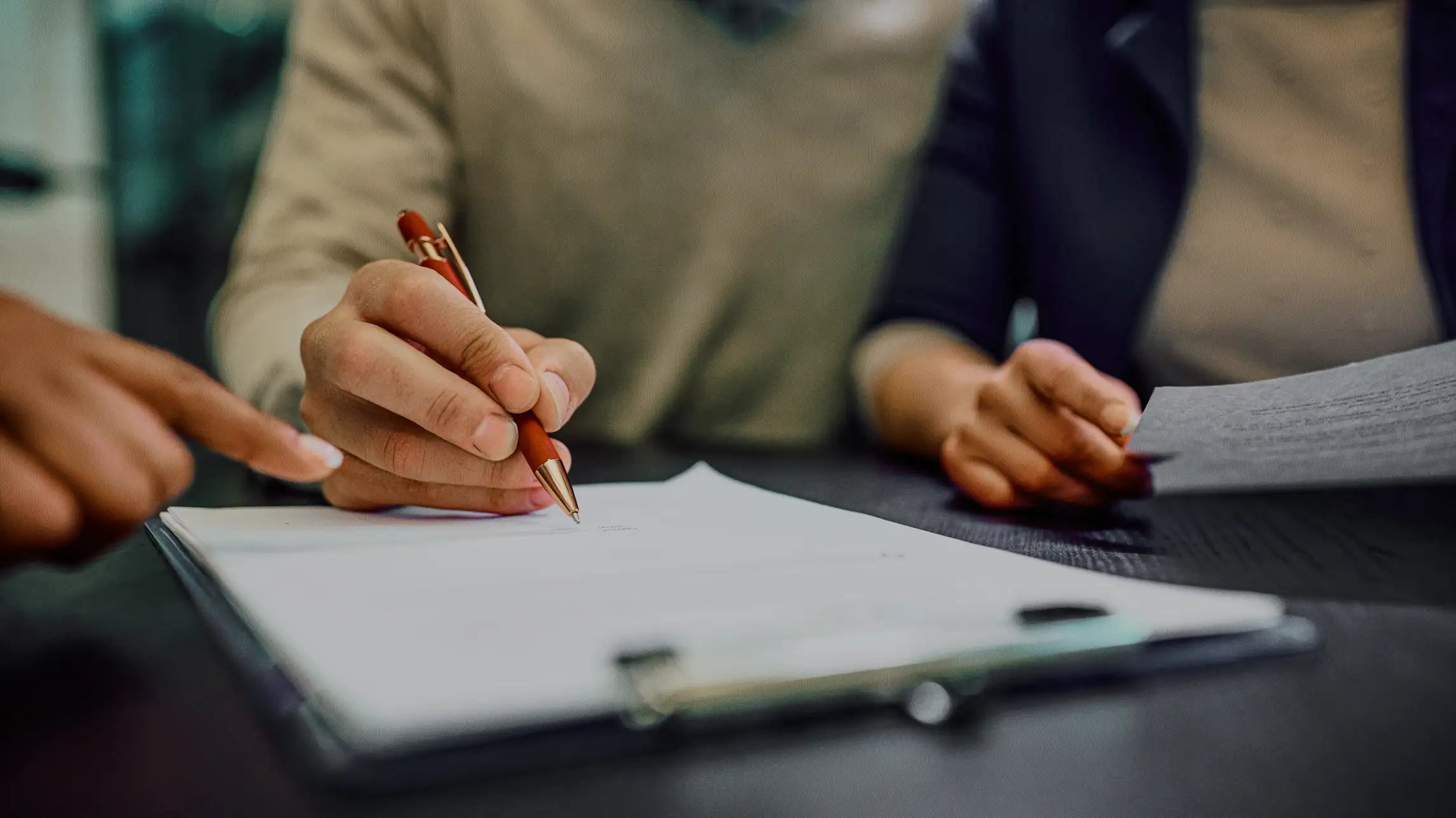 Bail agent supporting family signing bond application