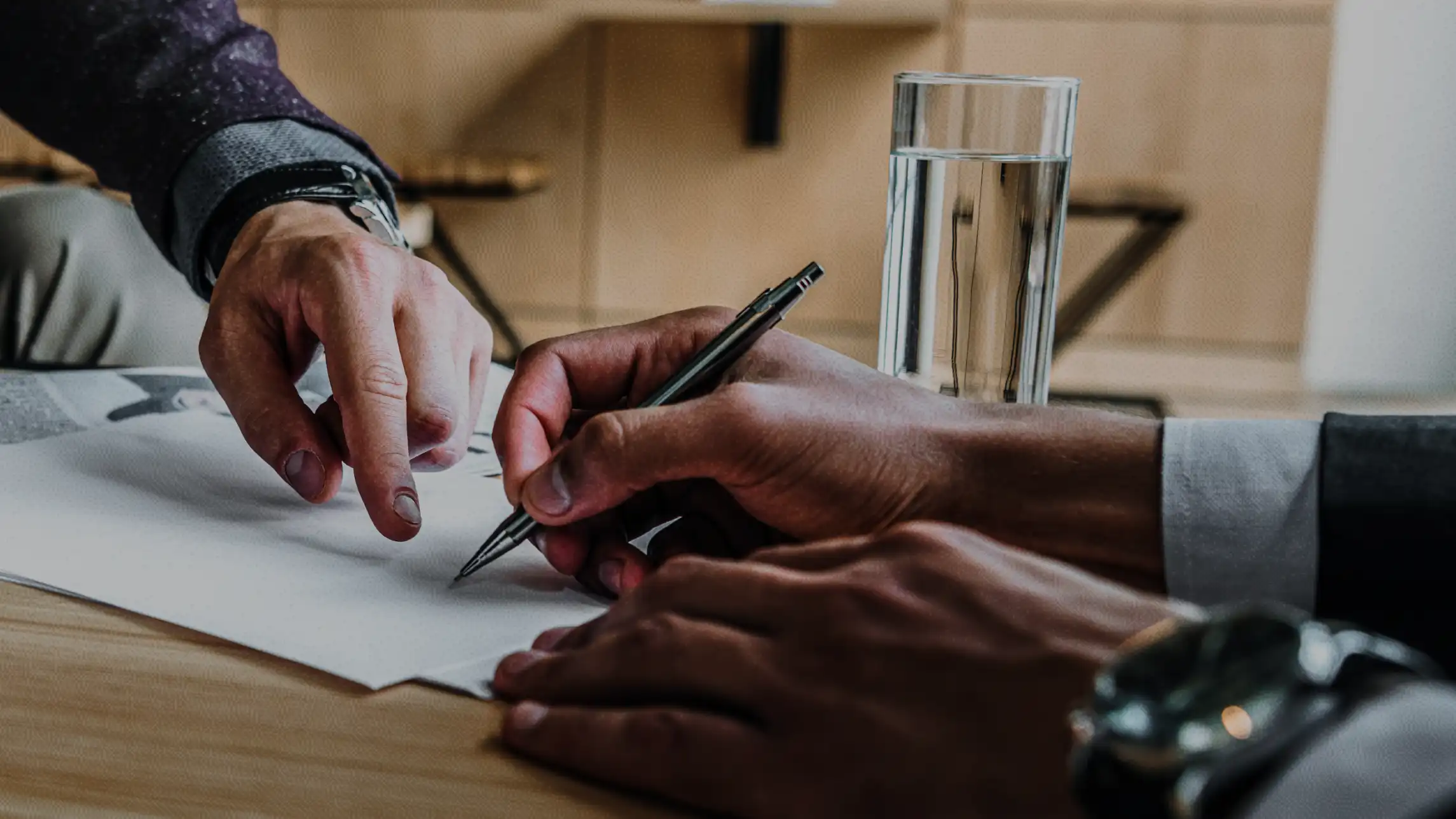 Man signing paperwork