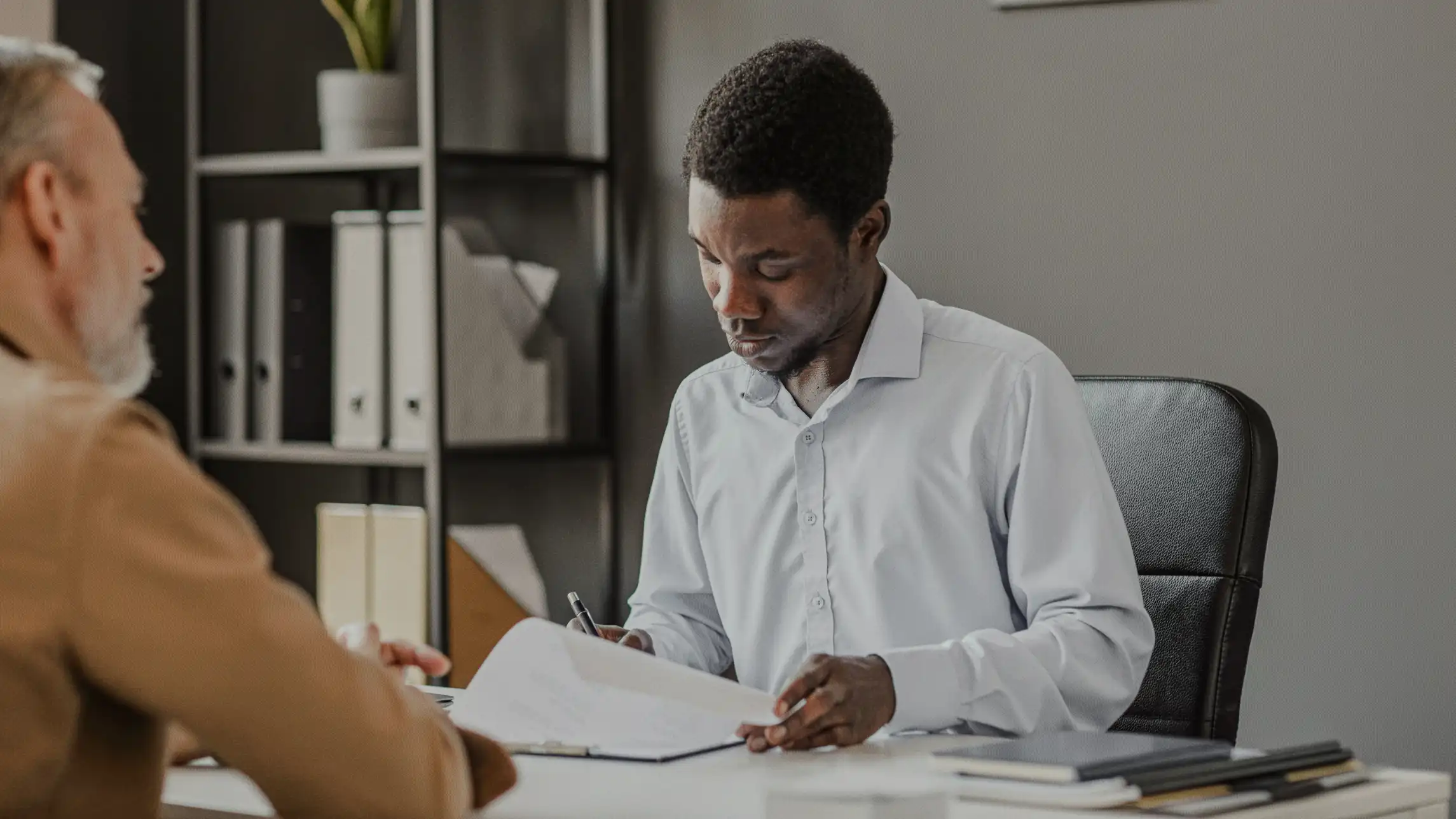 Man reviewing bail bond application in office