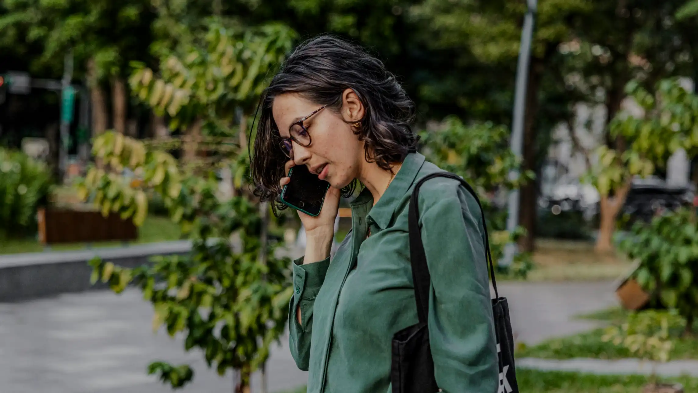 Woman talking on mobile phone outside